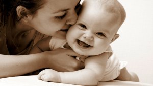 baby laughing mother kissing mom kiss