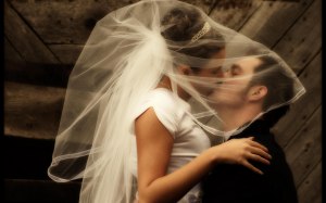 bride and handsome bridegroom kissing luck