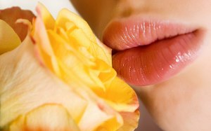 girl kissing flower close look picture