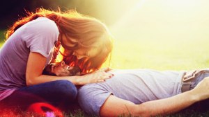 boy lying down with girl kissing 5